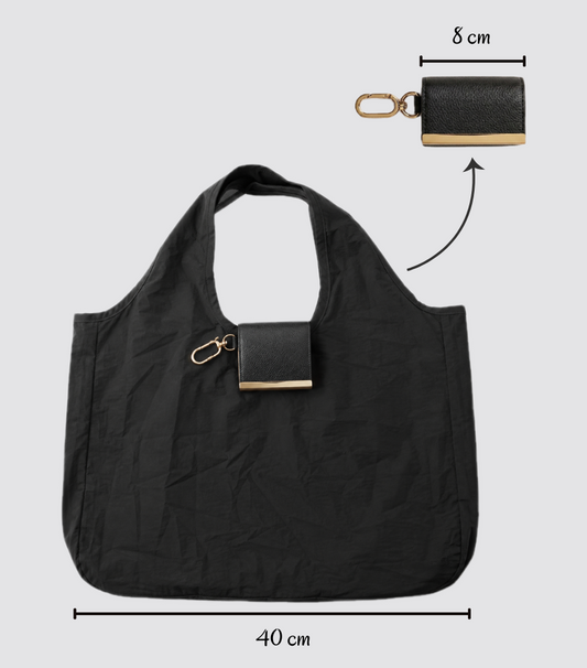 Black foldable tote bag shown open and folded