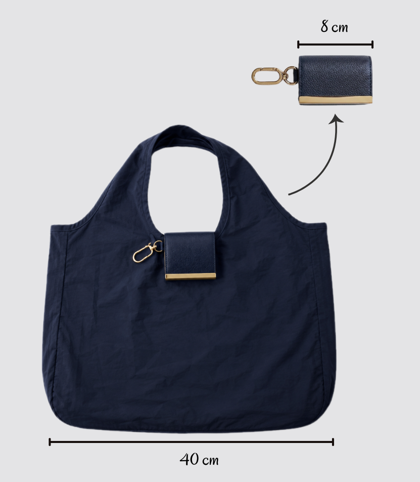Navy foldable tote shown open and folded