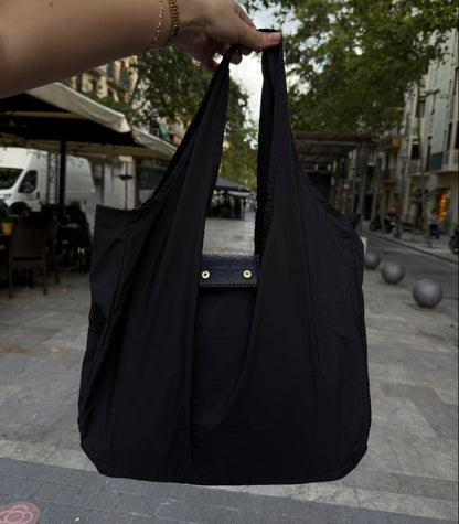 Black foldable tote with snap closure detail