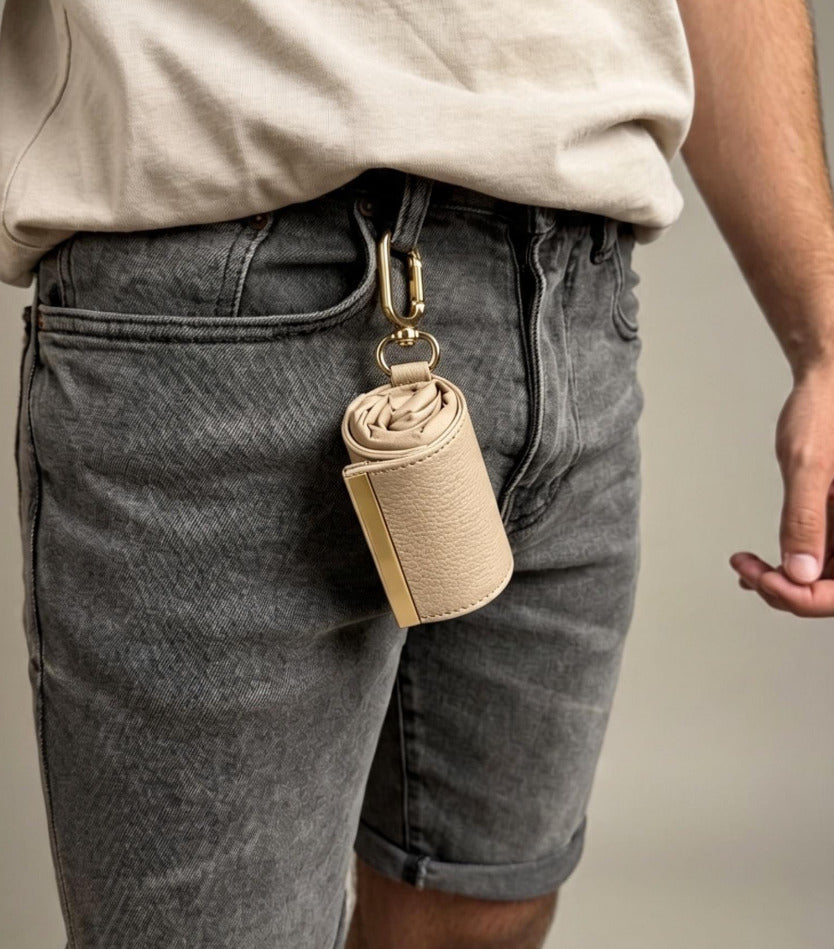 Beige compact pouch clipped to belt loop