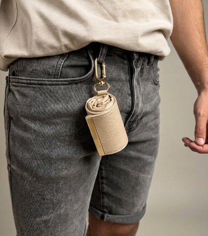 Beige compact pouch clipped to belt loop