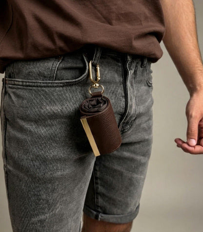 Brown compact pouch clipped to belt loop