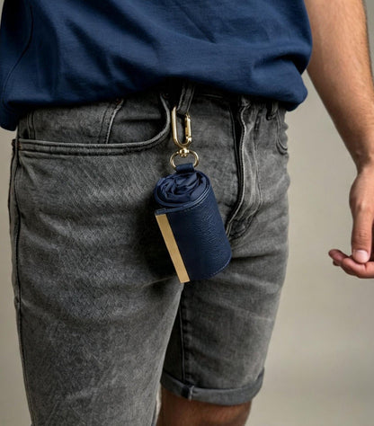 Navy compact pouch clipped to belt loop