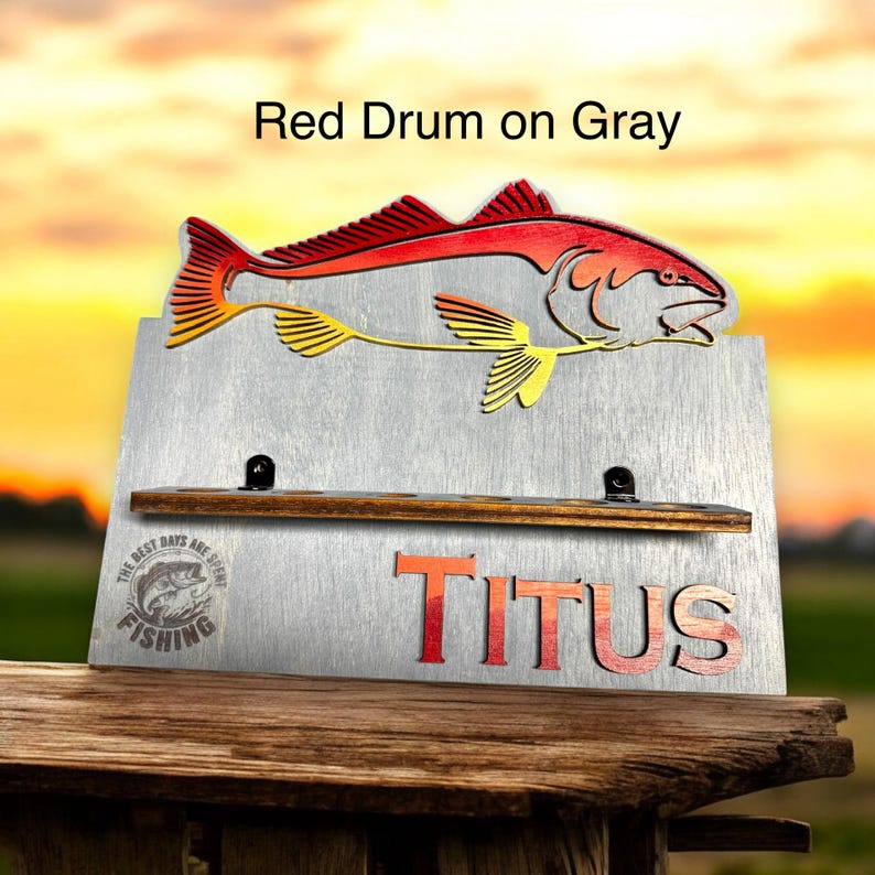 Colorful fish design personalized rod holder on gray wood
